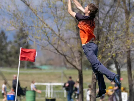 Player jumping high to grab the disc out of the air
